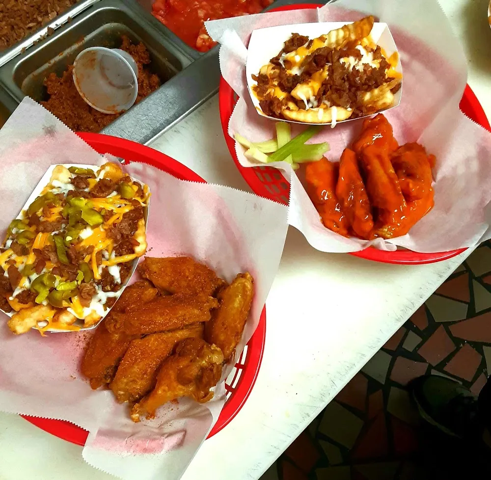 Old Bay Tossed Wings Trash Can Fries Medium Hot Sauce Tossed Wings and Bacon Cheese Fries